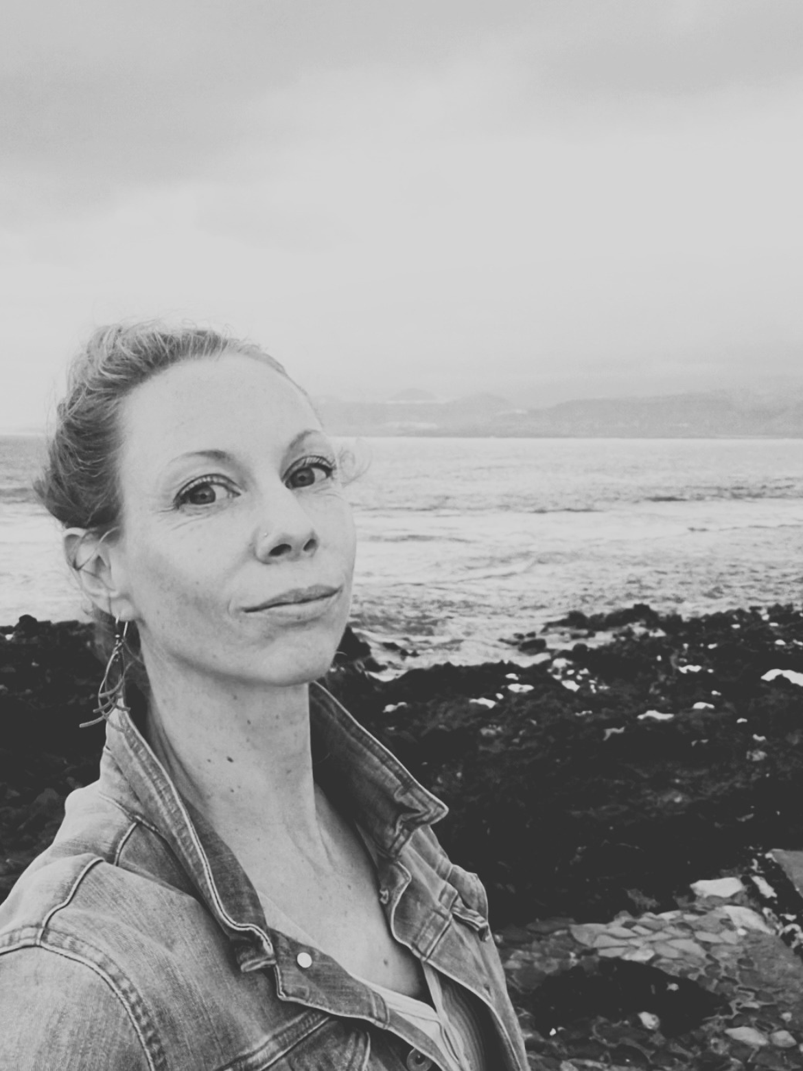 calm grounded practitioner offering nervous system recalibration bodywork